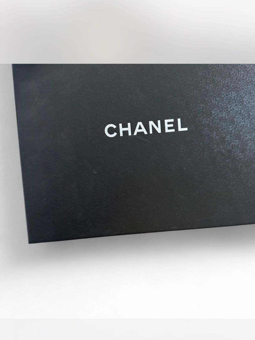 CHANEL Black and Gold Signature Logo Slip-On Sneakers - Picture 4 of 4